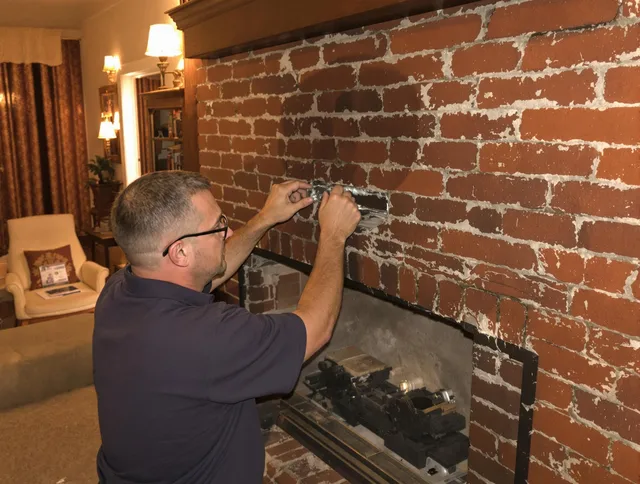 Richmond Hill Chimney Sweep expert fixing a fireplace in Richmond Hill, GA